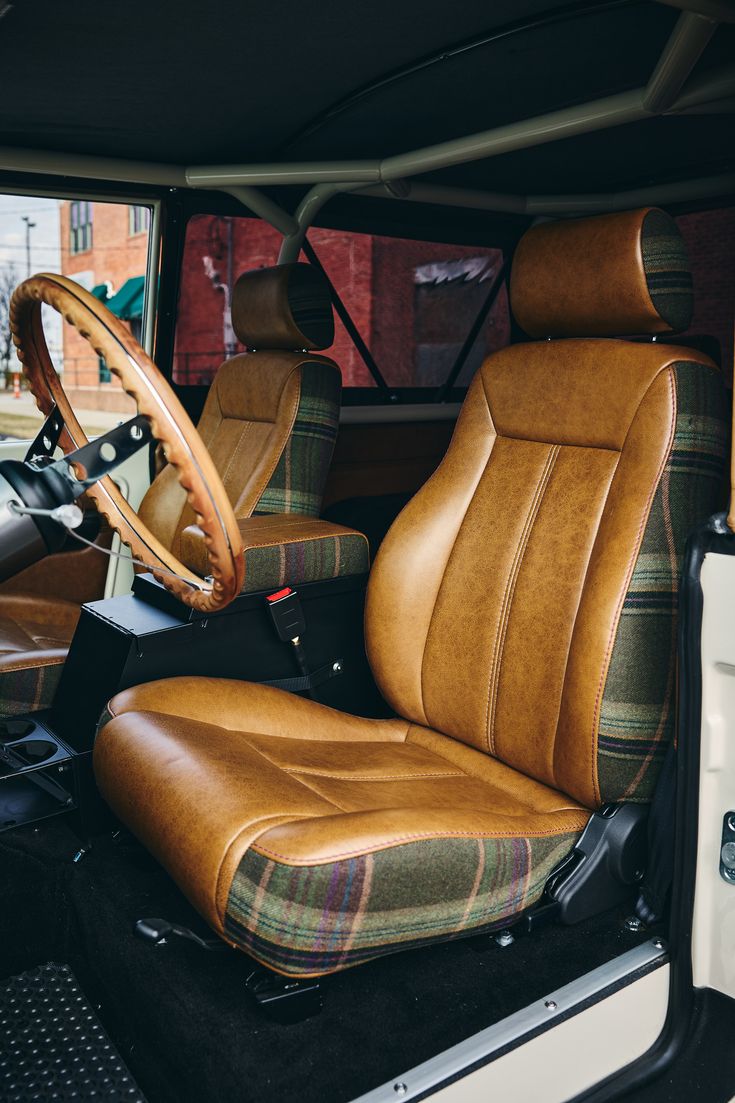 Whiskey leather over Tartan Plaid from Classic Ford Broncos Bozeman Commission Bronco Ii Interior, Cool Truck Interior Ideas, Truck Interior Ideas, Classic Car Interior, Vehicle Upholstery, Scout Truck, Classic Toyota, Bronco Truck, Western Car