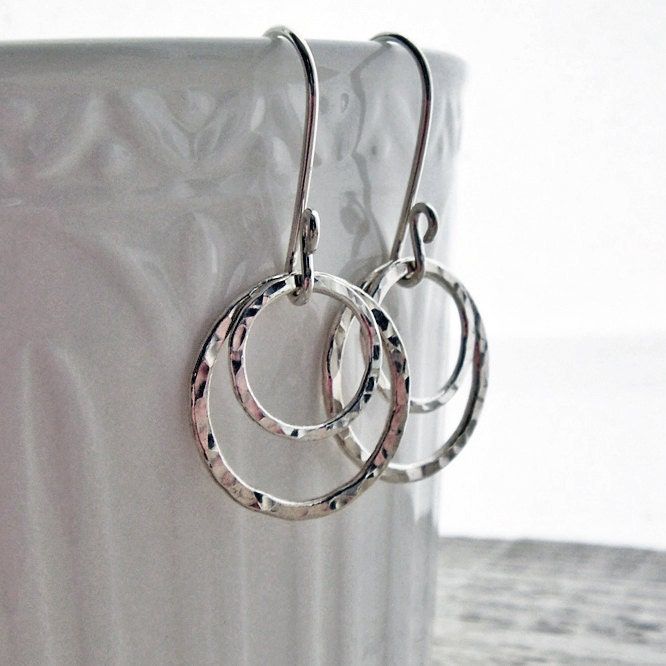 "Sterling Silver Earrings, Hammered Circle Earrings, Hammered Hoop Earrings, Argentium Sterling Silver, Modern jewelry, Silver Dangle Earring Hammered Circles made from fusing argentium sterling silver wire dangle from hand formed ear wires in these simple, classic earrings. All materials are tarnish resistant Argentium sterling silver. Ear wires are hammered rings are tumbled for superb shine and durability. Total length from top curve of earwire: 1 1/4\" (3.3cm) Diameter of largest ring: 5/8\" Modern Jewelry Silver, Jordan Earrings, Pmc Earrings, Silver Hammered Ring, Silversmithing Jewelry, Rectangular Earrings, Silver Clay, Hammered Silver Ring, Hammered Hoop Earrings