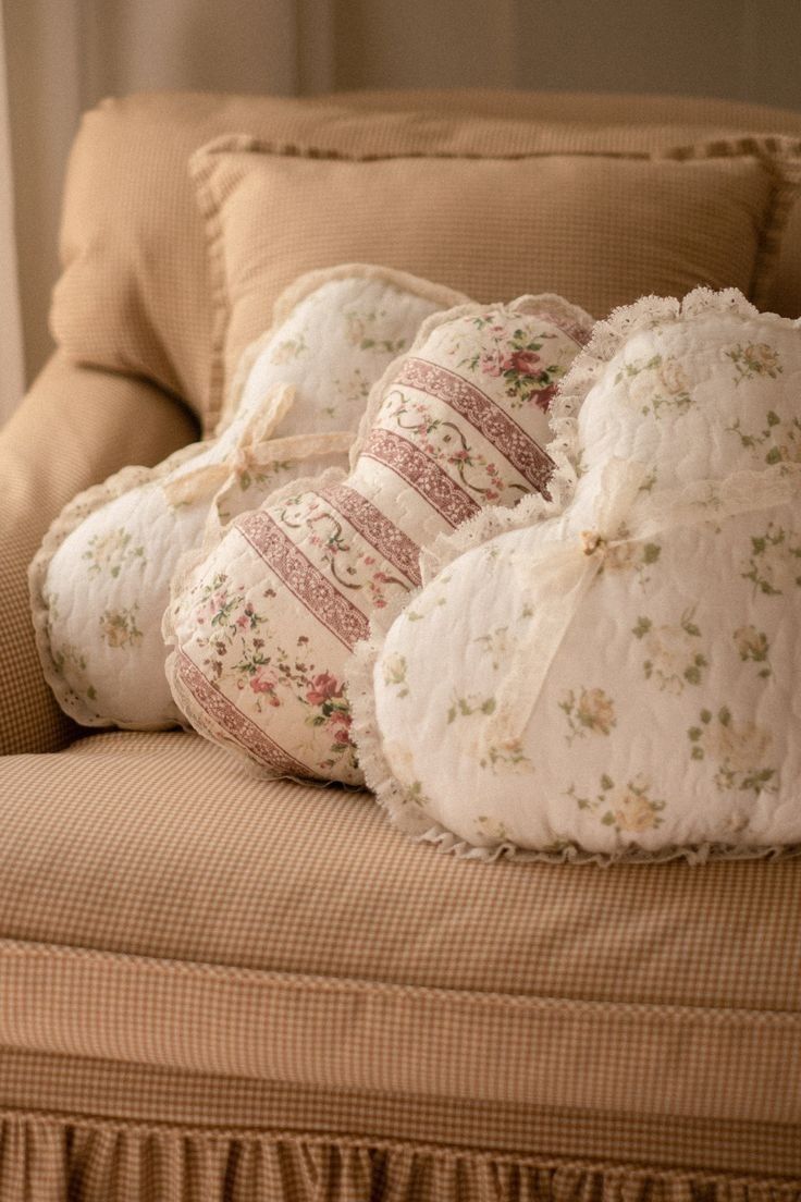 four pillows stacked on top of each other on a couch