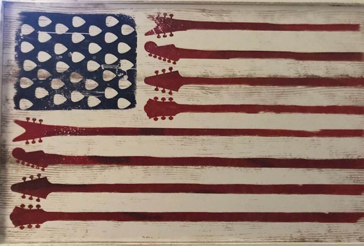 an american flag painted on wood with white dots and red, white, and blue stripes