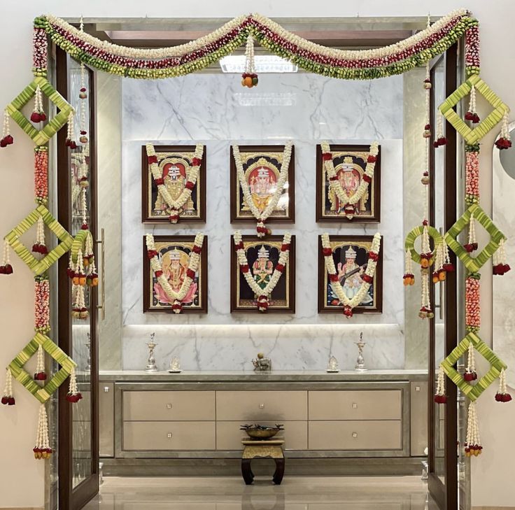 a room decorated with paintings and decorations on the wall