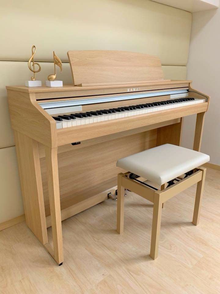 a piano with a stool next to it