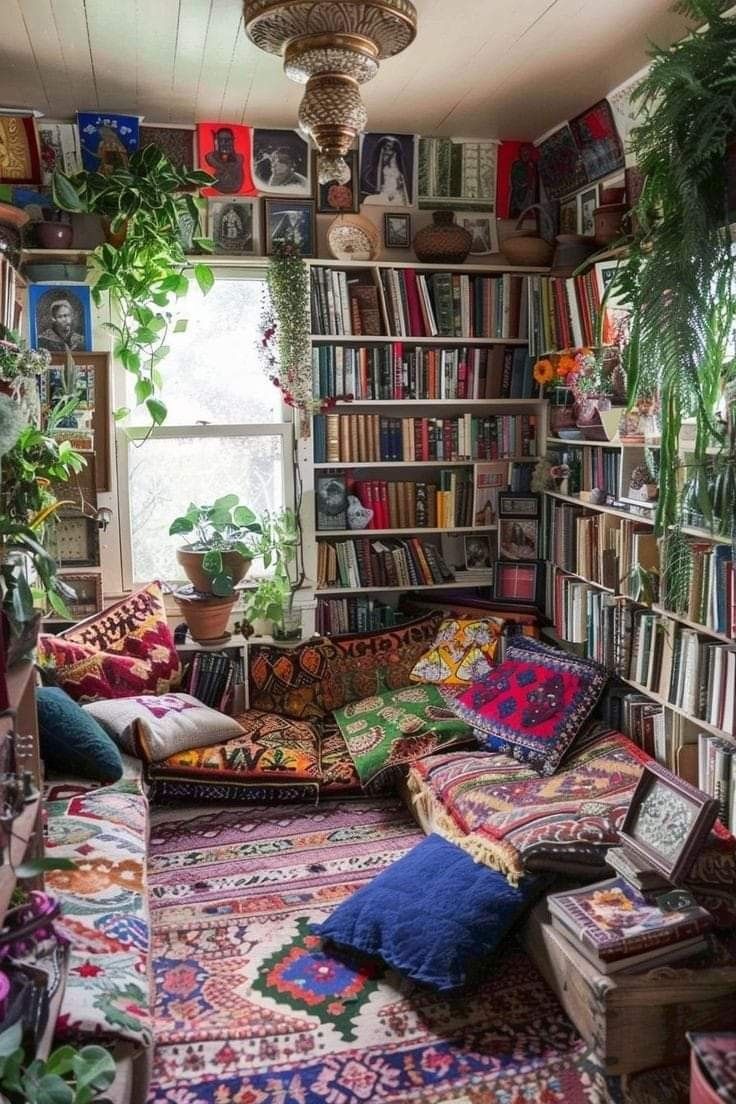 a room filled with lots of books and plants