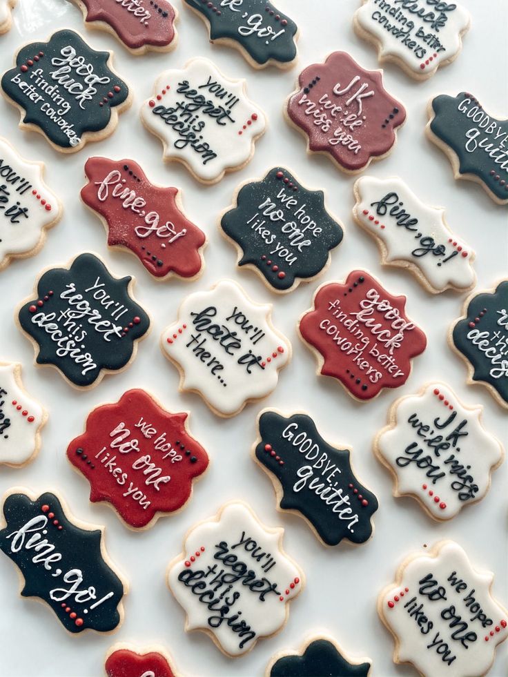 decorated cookies are displayed on a table