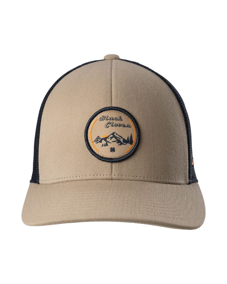 Whether you're a rugged outdoorsman or you prefer to look out the window, our Cottonwood Hat will help you look the part. Khaki in color accented with breathable navy mesh, this adjustable snapback hat features an HD printed patch with a tribute to the mountains. Pair it with a sweatshirt or hoodie for the perfect mountain man look. Brown Trucker Hat With Logo Patch For Outdoor, Logo Patch Trucker Hat For Camping, Camping Trucker Hat With Logo Patch, Brown Six-panel Trucker Hat For Outdoor Activities, Trucker Style Snapback Hat For Camping, Leather Patch Trucker Hat For Camping, Trucker Six-panel Snapback Hat For Camping, Outdoor Six-panel Trucker Hat With Logo Patch, Brown Baseball Cap Trucker Hat For Hiking