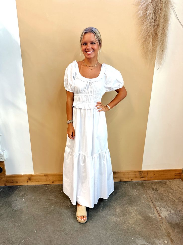 Introducing our Hannah Maxi Dress, the ultimate summer must-have! The short puffed sleeves and elastic waist provide a flattering fit, while the tiered design adds a touch of elegance. Made with 100% cotton, this dress is not just stylish, but also comfortable and breathable. Get ready to turn heads and feel confident in our Hannah Maxi Dress! Dress runs true to size. Model is wearing a size S. Cotton Puff Sleeve Mini Dress For Day Out, Cotton Puff Sleeve Dress For Day Out, Casual Summer Puff Sleeve Dress With Gathered Sleeves, Chic Cotton Tiered Dress For Vacation, Cotton Puff Sleeve Dress For Summer Day Out, Cotton Puff Sleeve Ruched Dress For Day Out, Casual Cotton Tiered Spring Dress, Cotton Puff Sleeve Dress With Smocked Back, Casual Cotton Puff Sleeve Dress For Daywear