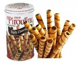 a can of chocolate brownie sticks next to some cinnamon sticks