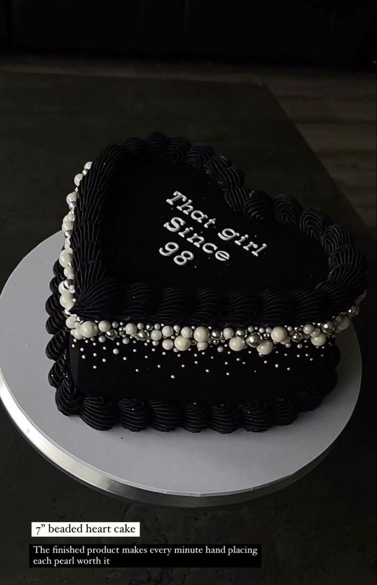 a heart shaped cake with pearls on it