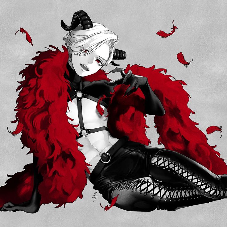 a woman dressed in black and white with red feathers