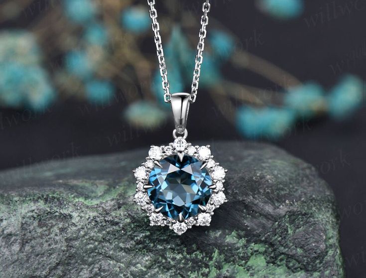 ***This gorgeous London blue topaz necklace features a 14k rose gold chain and round London blue topaz with a diamond halo design, brilliant and shiny. Perfect for various occasions with a variety of gorgeous dresses***- Metal: Solid gold(9K/14K/18K white/yellow/rose gold),925 sterling silver, platinum available- Main Stone: 8mm natural London blue topaz- Accent Stone: diamonds or moissanites- Chain: 16+2 inches. The chain can be adjustable to 18 Inches.- Can be personalized: Yes Round Jewelry With Diamond Accents For Gift, Exquisite Blue Topaz Necklace Gift, Dainty Sapphire Jewelry With Diamond Accents, Exquisite Blue Topaz Necklace For Gift, Sapphire Jewelry With Vvs Clarity In Round Shape, Round Sapphire Jewelry With Vvs Clarity, Sapphire Pendant With Halo Setting, Sapphire Cubic Zirconia Pendant Jewelry, Exquisite Sapphire Round Jewelry