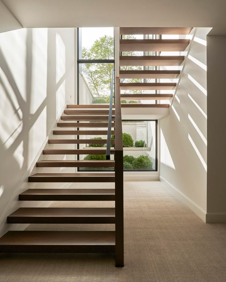 the stairs in this modern house are made of wood