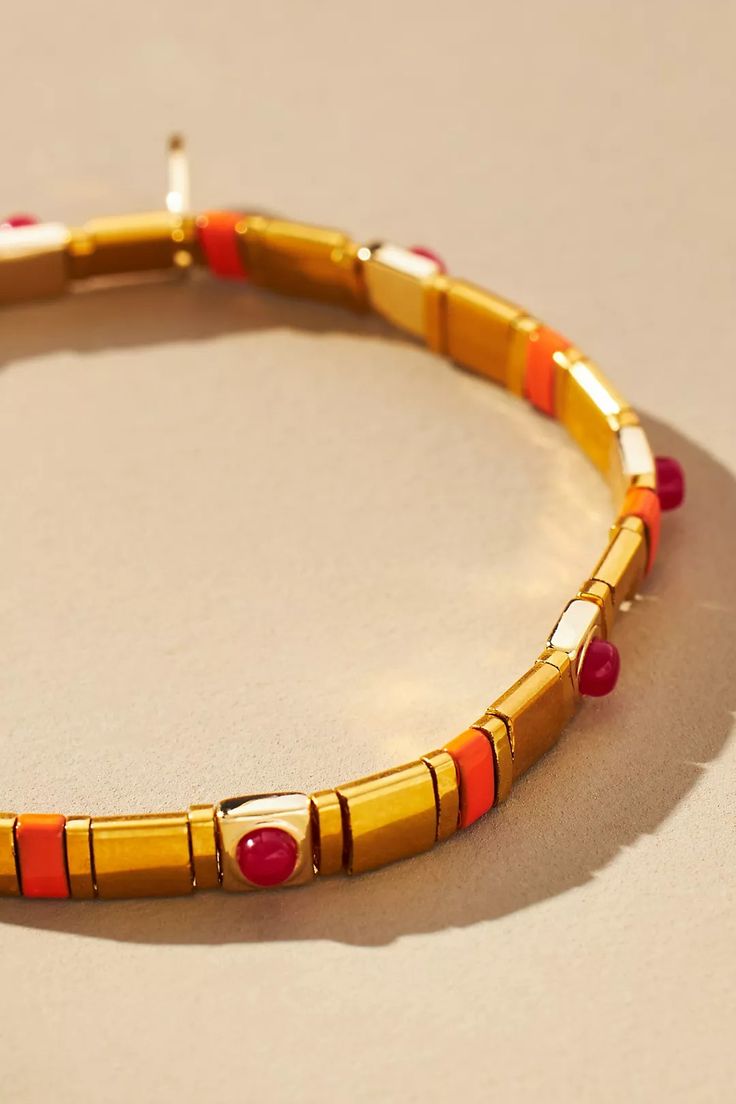 Beaded Chicklet Bracelet | Anthropologie Bold Gold Bracelets For Gift, Bold Gold Bracelets For Gifts, Bold Bangle Jewelry Gift, Bold Bangle Jewelry For Gifts, Bold Bangle Jewelry As A Gift, Bold Adjustable Bracelets As Gift, Gold Bangle With Colorful Beads, Adjustable Round Enamel Bracelets, Adjustable Gold Enamel Bracelets