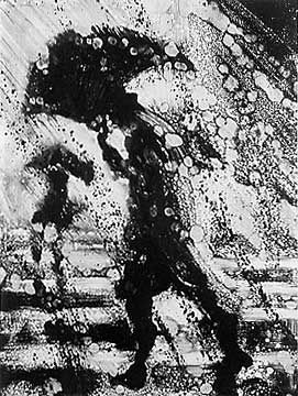 a black and white photo of two people walking in the rain with an umbrella over their heads