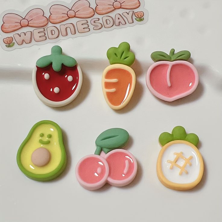 some fruit and vegetables are on a white surface with a sticker that says wednesday