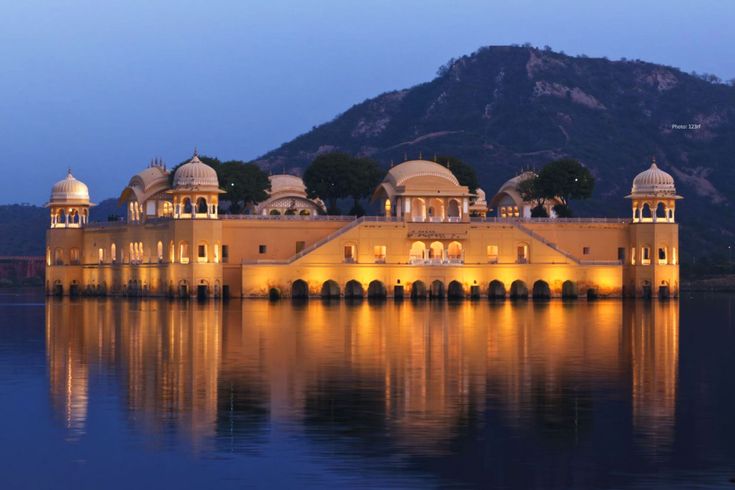 a large building sitting on top of a body of water