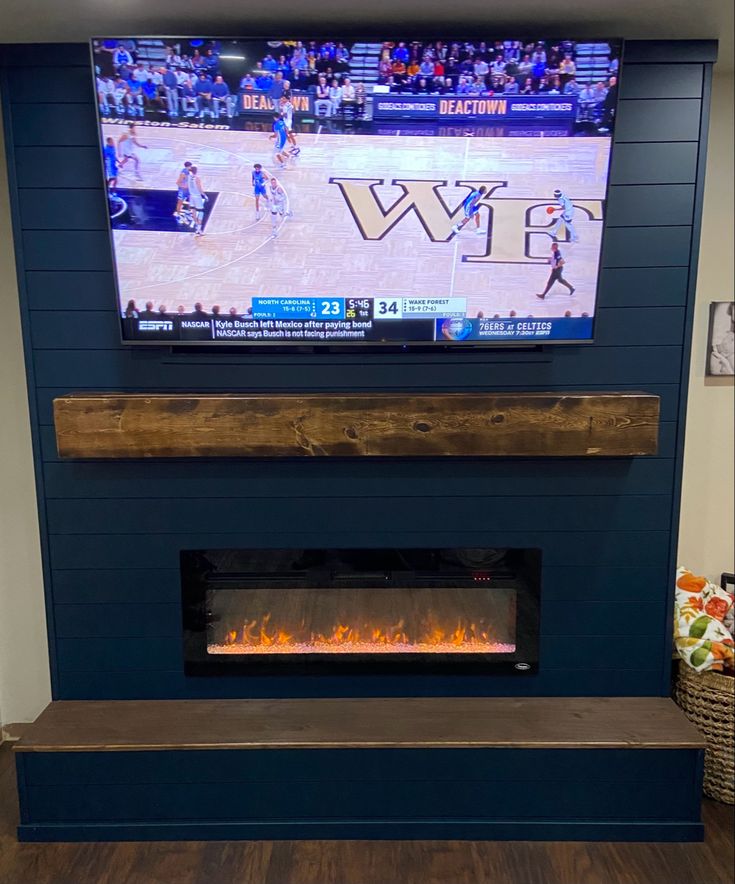 a flat screen tv mounted above a fire place