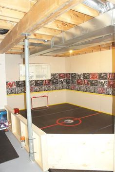 an indoor basketball court in the middle of a room