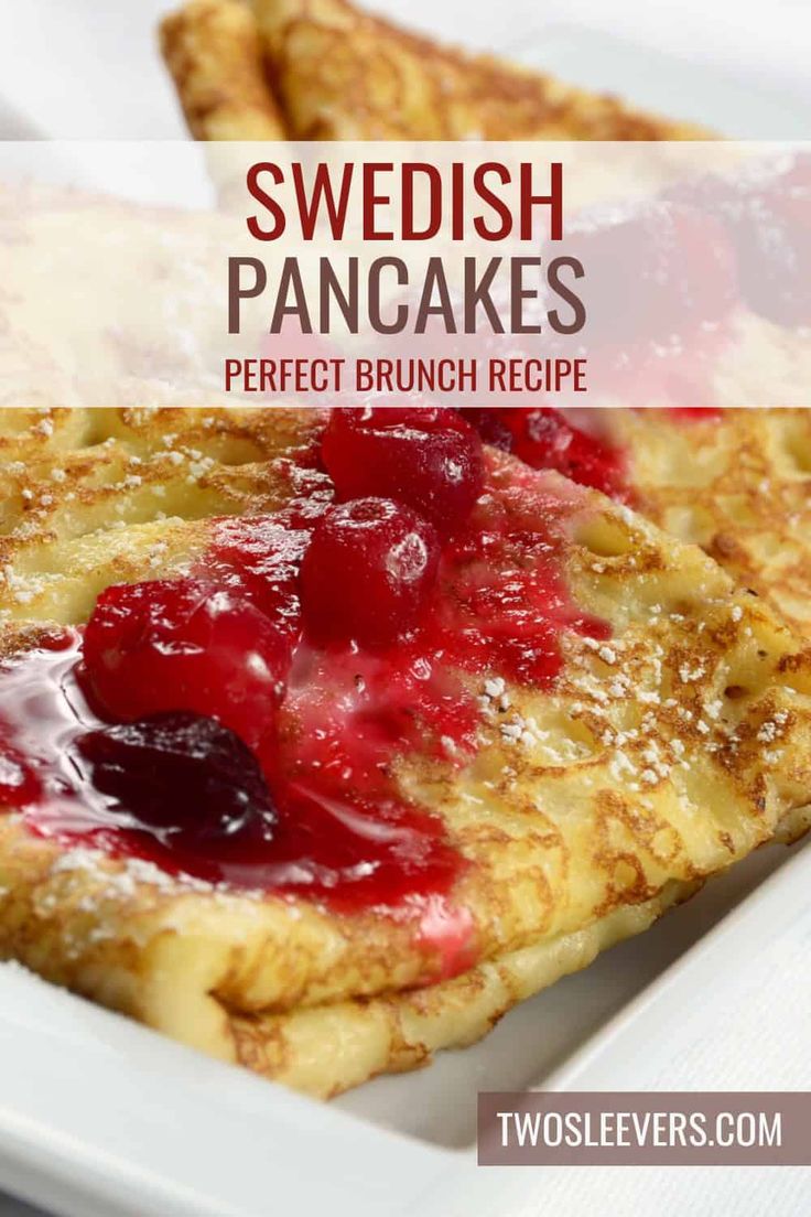 a close up of a pancake on a plate with berries and syrup in it