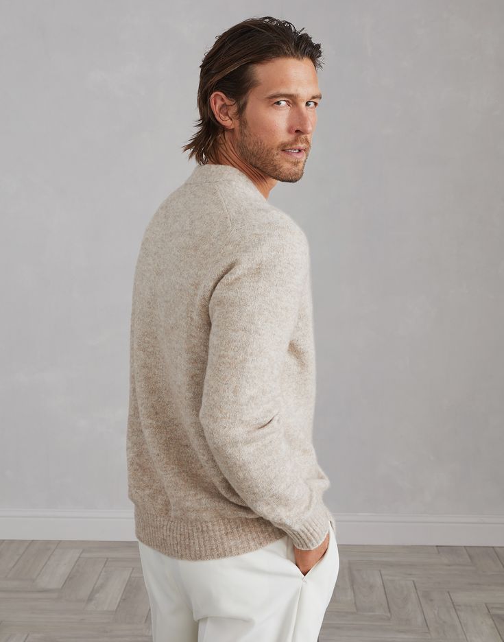 Alpaca, cotton and wool cardigan with metal buttons Accurate materials research and the iconic knitting of Brunello Cucinelli knitwear enhance the classic feel of this alpaca, cotton and wool cardigan. The blend of natural yarns gives the garment a soft and compact hand, delivering comfort and warmth. The regular fit is complemented by metal buttons. Classic Merino Wool Cardigan With Ribbed Cuffs, Winter Wool Polo Sweater With Button Cuffs, Classic Lambswool Sweater, Classic Wool Polo Sweater With Button Cuffs, Classic Merino Wool Cardigan With Button Cuffs, Beige Wool Cardigan With Ribbed Cuffs, Classic Long Sleeve Lambswool Sweater, Classic Beige Wool V-neck Sweater, Beige Cashmere Cardigan With Ribbed Cuffs