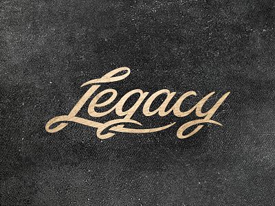 the word leggy written in gold foil on a black leather textured surface with white stitching