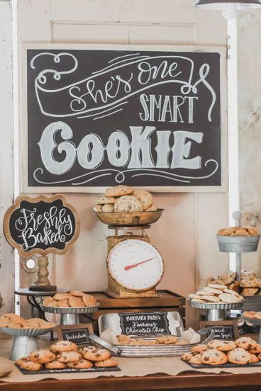 an assortment of cookies and pastries displayed on a table