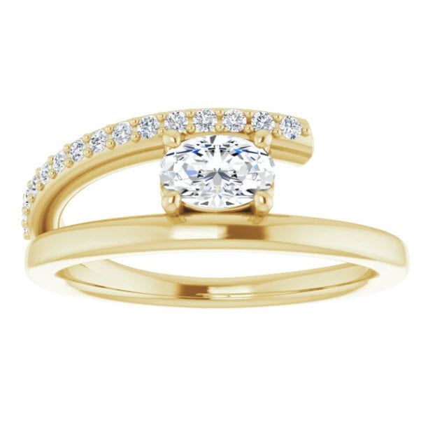 a yellow gold engagement ring set with a round diamond in the center and two rows of diamonds on each band