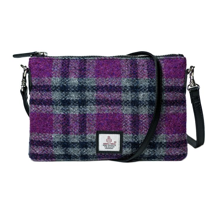 Harris Tweed Clutch Bag This Harris Tweed Bag is one of our most popular bags. It has a detachable strap and can be either a shoulder or clutch bag. Full Harris Tweed front panel with a top zip . Dimensions: 9" x 6" x 1.1/4" Fabulous wee Harris Tweed bag, clutch or shoulder strap… you choose. Match with one of these cute purses. Harris Tweed is known as 'The Big Cloth' in Scotland because Harris Tweed will last you forever. Starting as a cottage industry, the canny islanders living on the Isle o Harris Tweed Bag, Cross Shoulder Bag, Tweed Purse, Unique Clutch, Plaid Purse, Tweed Bag, Cross Shoulder Bags, Zip Purse, Handcrafted Bags