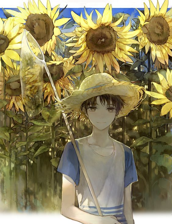 a woman in a sunflower field wearing a straw hat