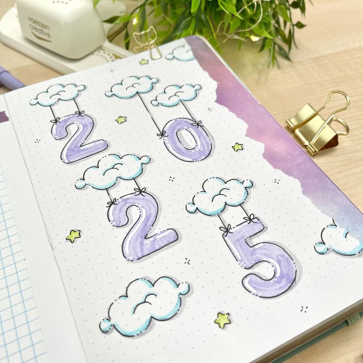 an open notebook with numbers and clouds on it