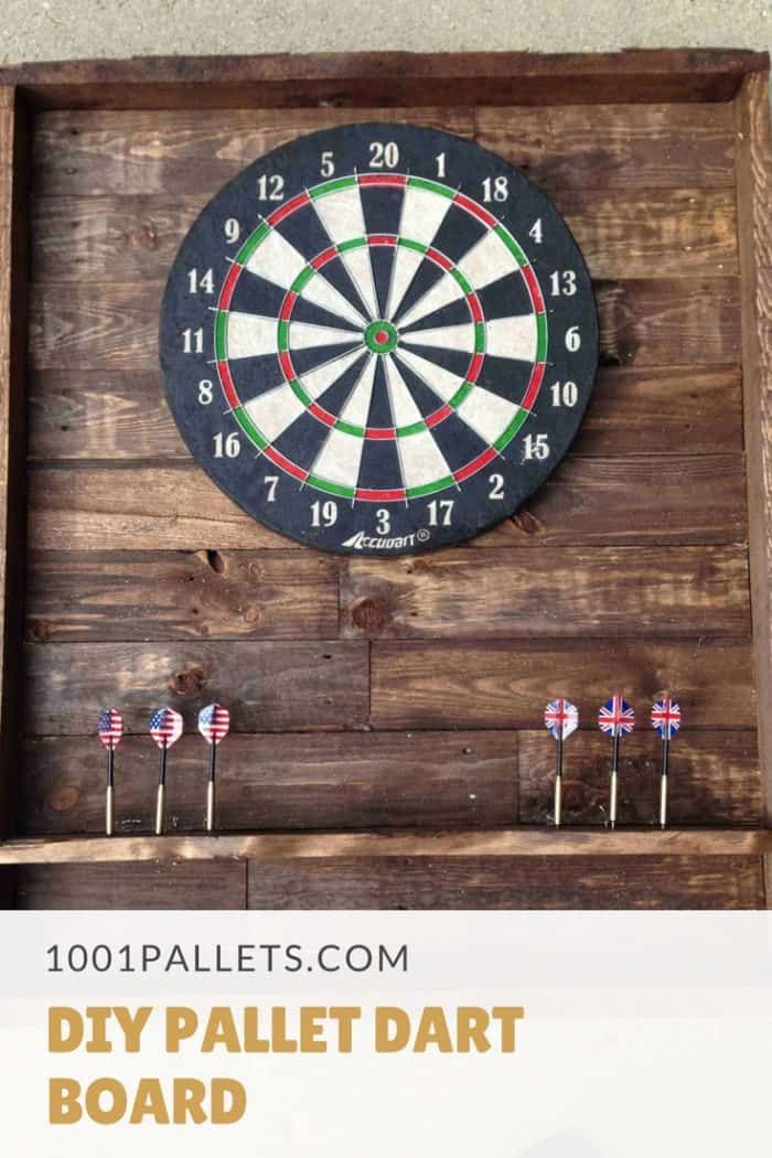 the diy pallet dart board is made from an old wooden box and has darts in it