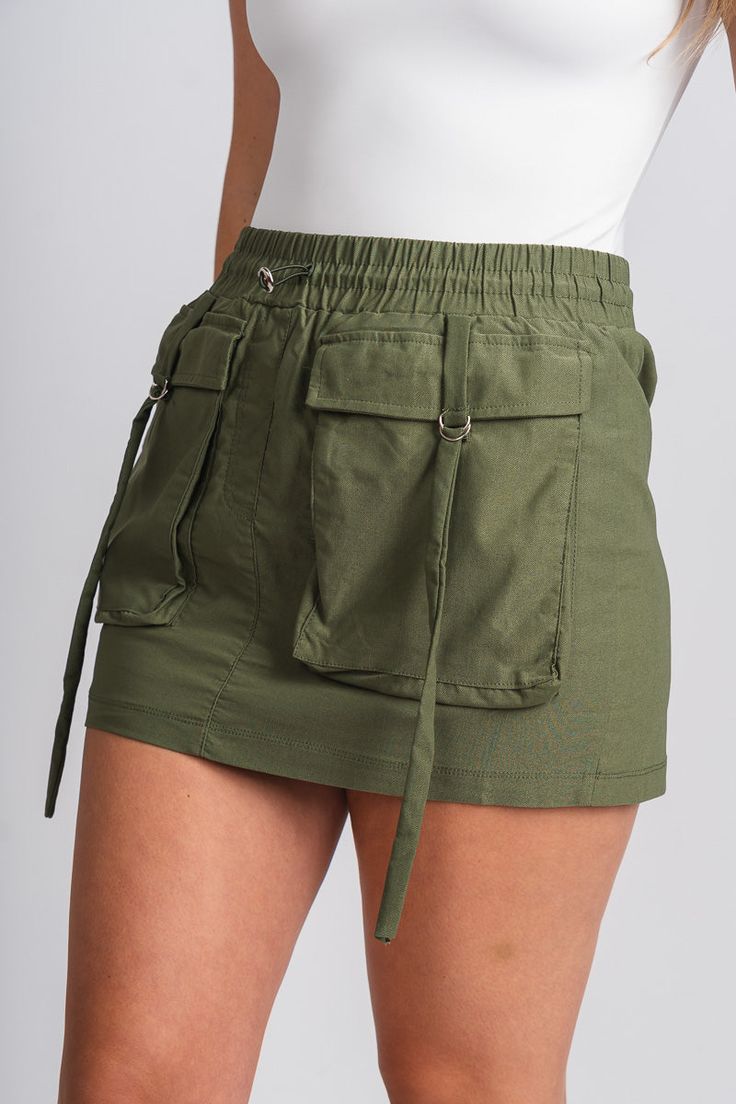 Cargo mini skirt olive | Lush Fashion Lounge: boutique fashion skirts, affordable boutique skirts, cute affordable skirts Mini Shorts With Pockets For Fall, Trendy Mini Cargo Skirt, Mini Length Shorts With Pockets For Fall, Trendy Fall Skort With Pockets, Trendy Mini Cargo Skirt With Pockets, High Waist Green Mini Skirt With Pockets, Trendy High Waist Skirt With Multiple Pockets, Trendy High-waist Skirt With Multiple Pockets, Short Green Skirt With Pockets