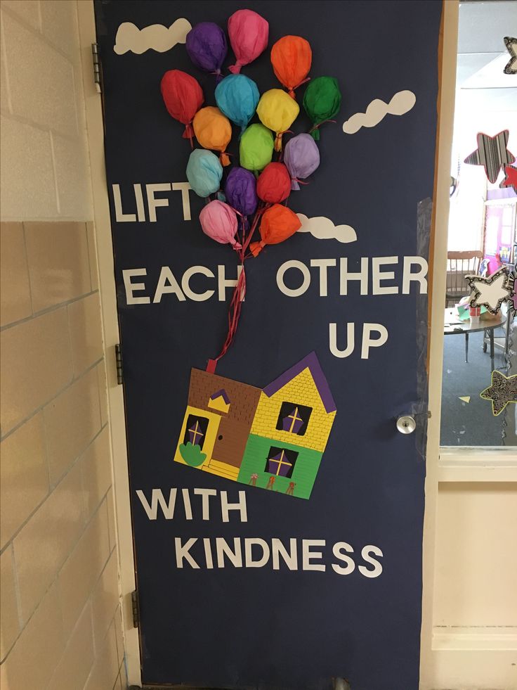 a door decorated with balloons and the words lift each other up with kindness on it