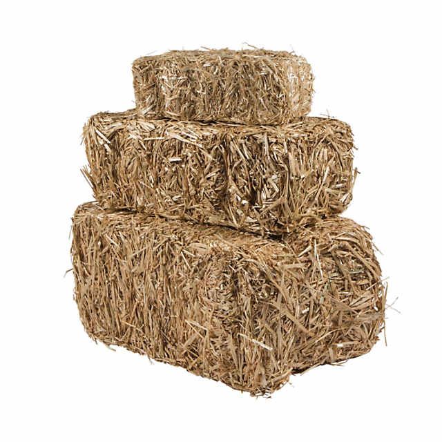 three bales of hay stacked on top of each other in front of a white background