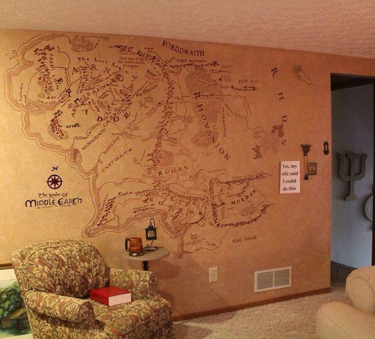 a living room with a large map on the wall