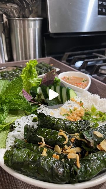 a white plate topped with green vegetables and rice