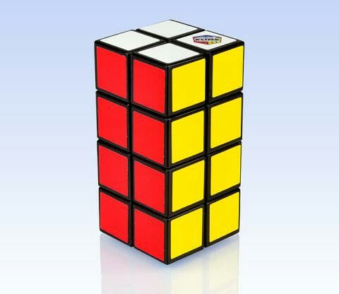 a rubik cube is shown on a white background with reflection in the middle and bottom half