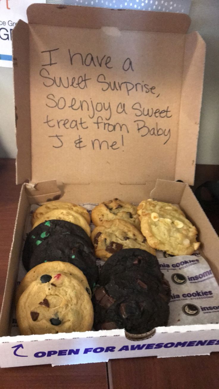 a box filled with lots of cookies on top of a table