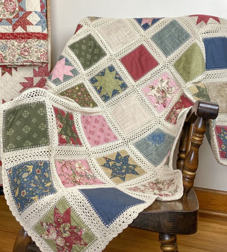 a quilted blanket is sitting on a chair