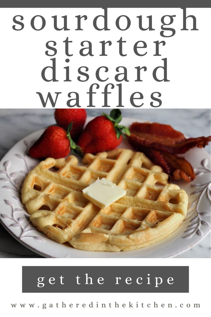 a white plate topped with waffles covered in butter