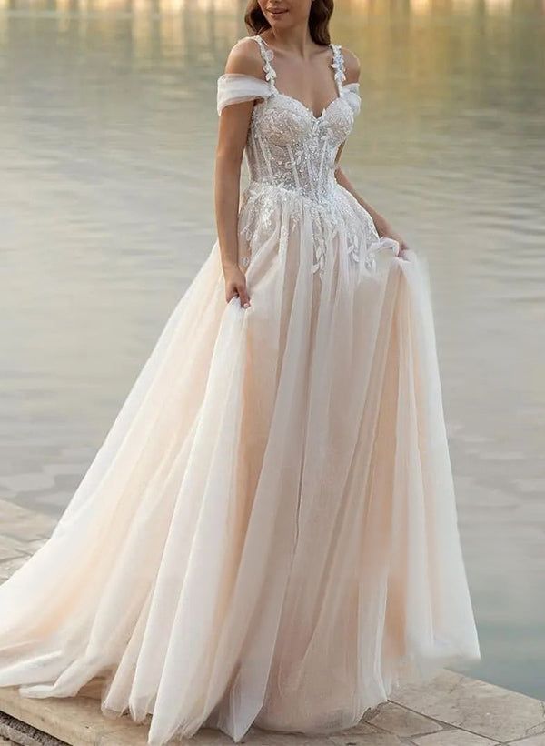 a woman in a wedding dress standing on the edge of a body of water with her hand on her hip