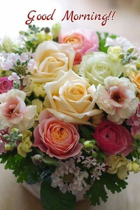 a vase filled with lots of different colored flowers