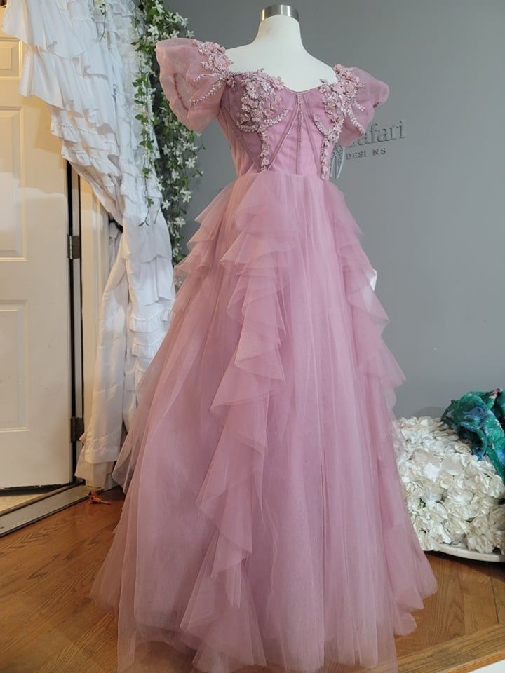 a dress on display in front of a window