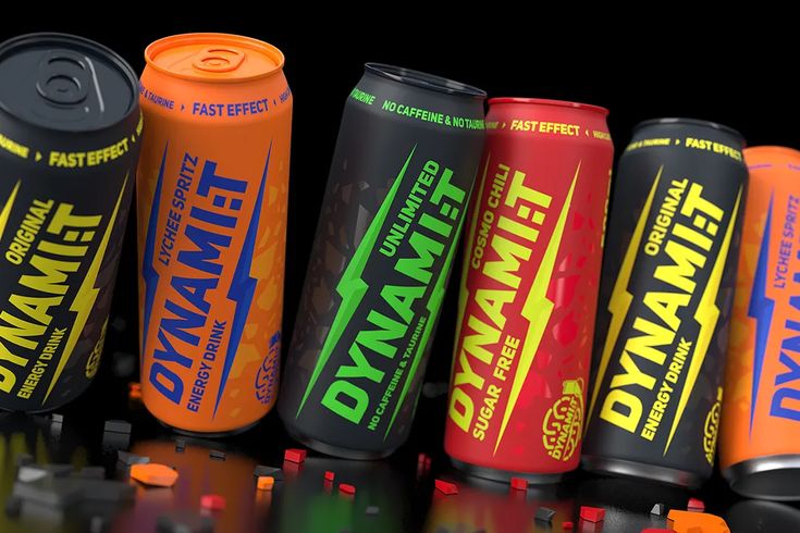 many different types of energy drinks are lined up in a row on a reflective surface