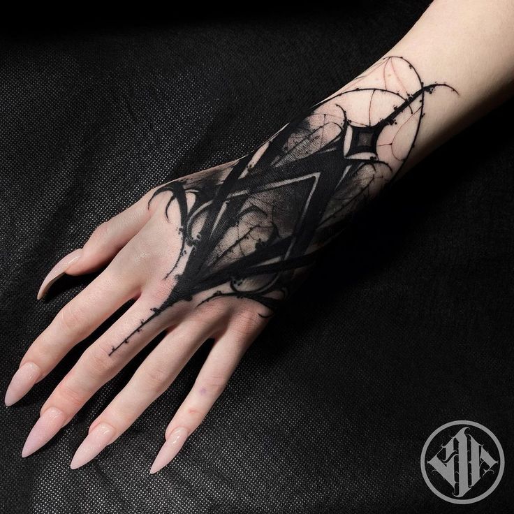 a woman's hand with black ink on it