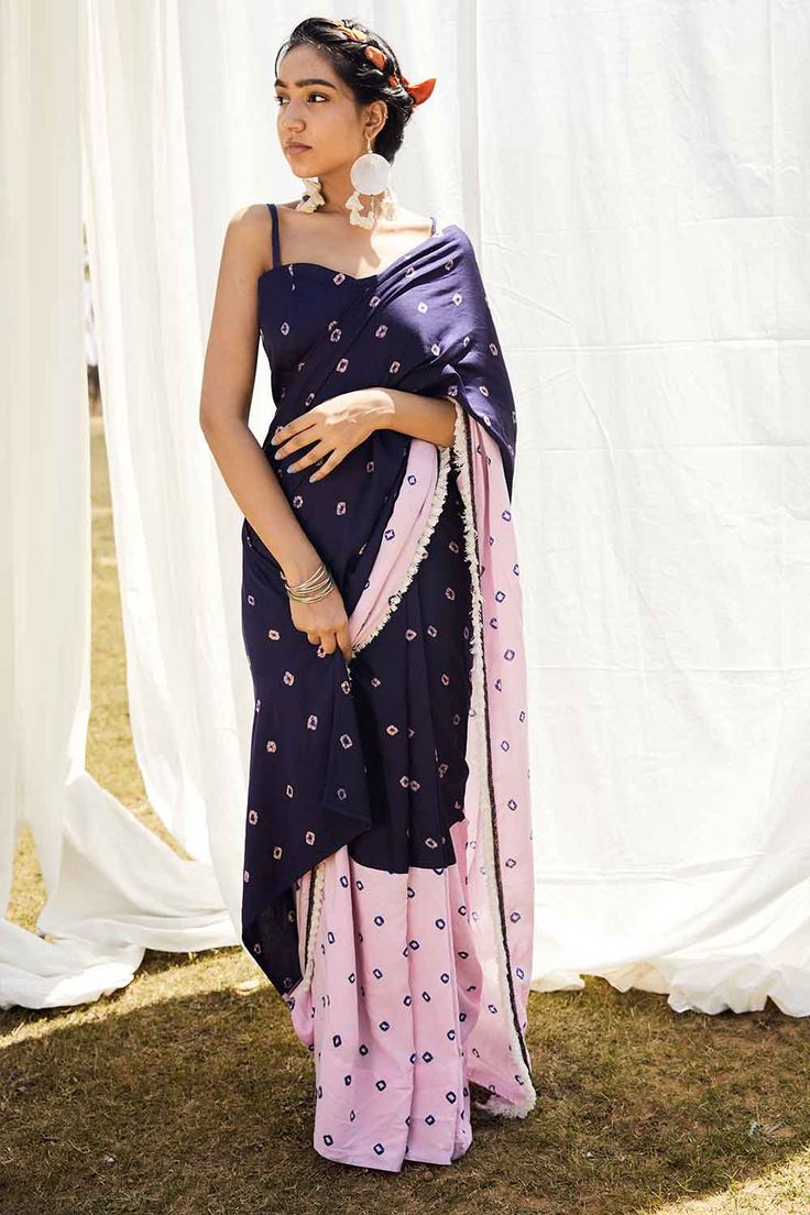 Feminine and charming, this hand tye and dye Bandhej pre-draped saree is a fashion statement that will make heads turn. Made in soft cotton satin, this unique saree is a perfect mix of modern and traditional. Bold, brilliant and stunning, this saree features two contrast coloured Bandhej and is highlighted with delicate hand embroidery and contrast tassels on the edge of the pallu. Great for the modern woman this saree comes with a bustier in the matching Bandhej with crochet lace straps and is Bohemian Chanderi Pre-draped Saree For Navratri, Bohemian Art Silk Pre-draped Saree With Dupatta, Bohemian Pre-draped Saree For Transitional Season, Festive Fusion Pre-draped Saree With Unstitched Blouse, Traditional Silk Pre-draped Saree For Summer, Bohemian Cotton Silk Pre-draped Saree, Fusion Style Pre-draped Saree For Festivals With Unstitched Blouse, Bohemian Pre-draped Saree For Festivals, Fusion Pre-draped Saree With Unstitched Blouse For Diwali