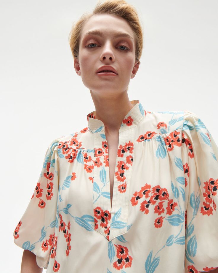 Hook and eye closure at neckline Length from Highest Point to Hem: 25" Dramatic, elbow-length puff sleeves Trapunto stitched neckline Silk Charmeuse Night Tops, Blouse Price, Puff Sleeve Blouse, Silk Charmeuse, Hook And Eye, Cropped Denim, Lantern Sleeves, Silk Top, Denim Top