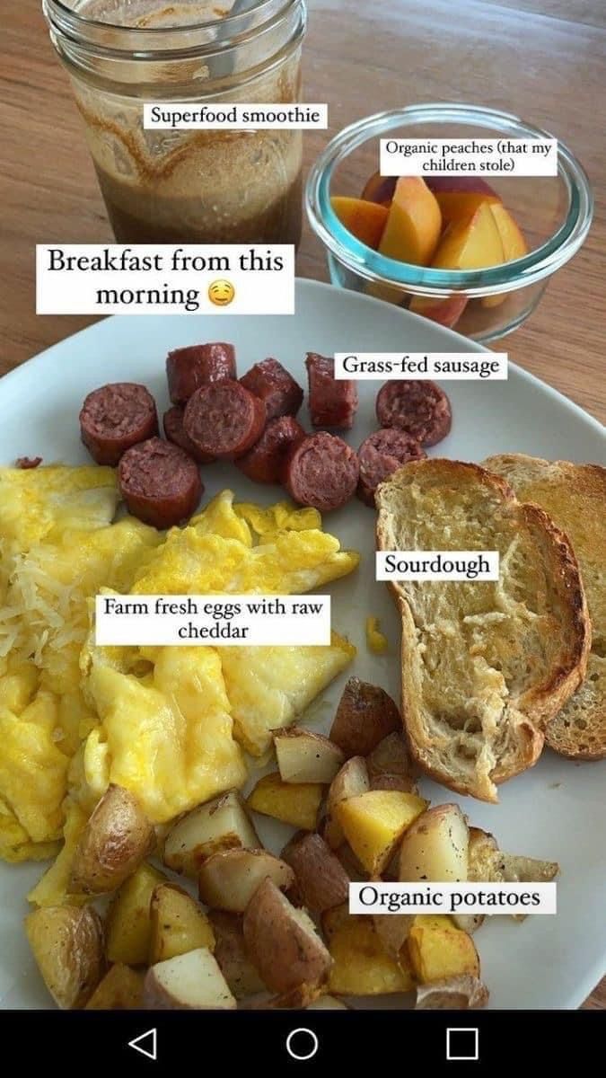 a plate with eggs, potatoes and sausage on it