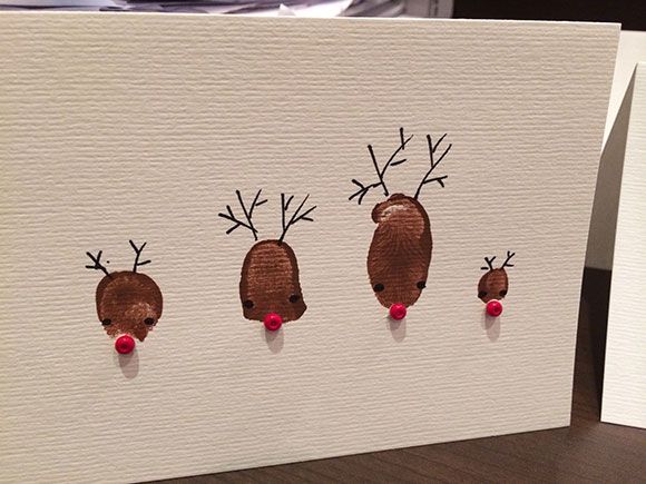 a card with three reindeer heads on it