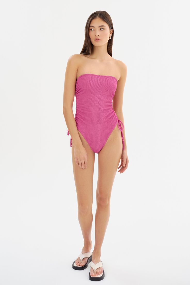 The ZARINA Strapless Swimsuit is an elegant addition to your beachwear repertoire. Crafted with sophistication and comfort in mind, it offers adjustable self-cords on the sides and anti-slip elastic at the top edge. The delicate ruching side details and crinkle fabric elegantly contours your silhouette as you bask in seaside splendor. Strapless Swimsuit, Crinkle Fabric, Swim Accessories, Dress Accessories, Skirt Pants, Best Sellers, Dress Pants, Dress Skirt, The Top