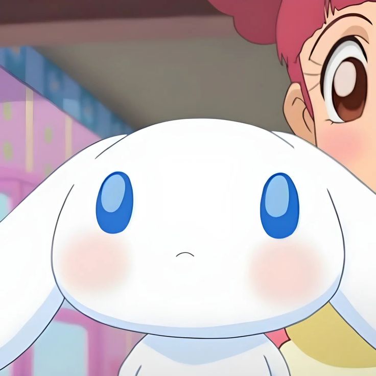 a girl with pink hair and blue eyes is holding a white rabbit in front of her face